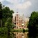 A historical brick castle surrounded by trees